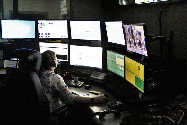dispatcher with the Fort McCoy Directorate of Emergency Services (DES) 911 Communications/Security Center, processes a request in the center at Fort McCoy, Wis